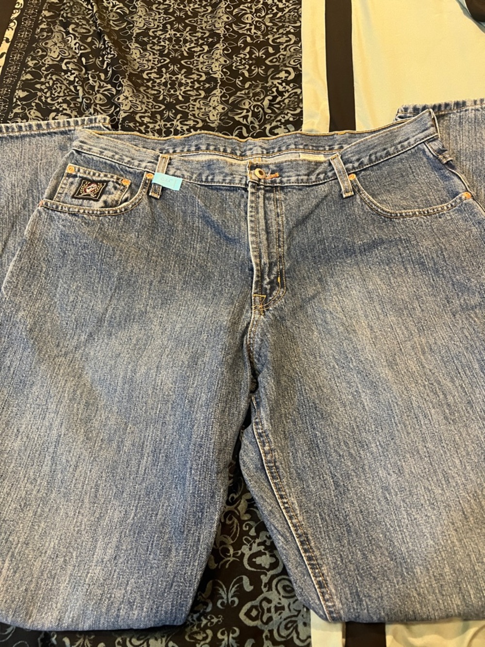 CINCH BLACK TAG Classic Light Wash Denim Jeans with Small Embroidered Patch